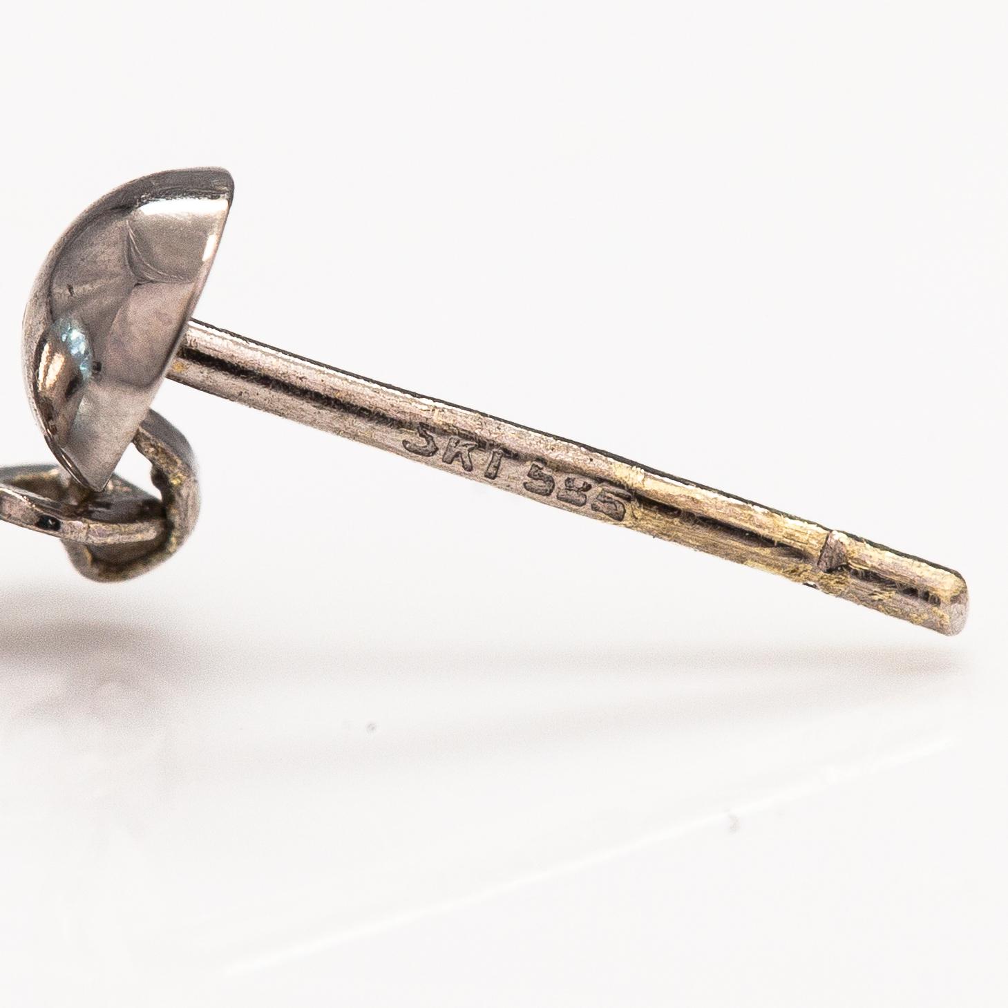 A pair of 14K white gold and topaz earrings.