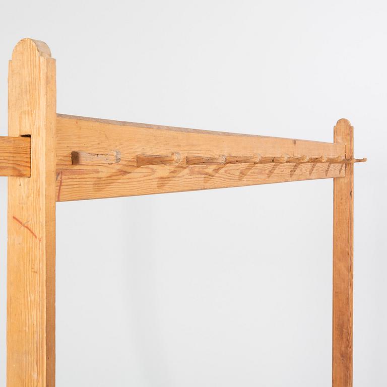 A pine clothes hanger from the first half of the 20th cenutry.