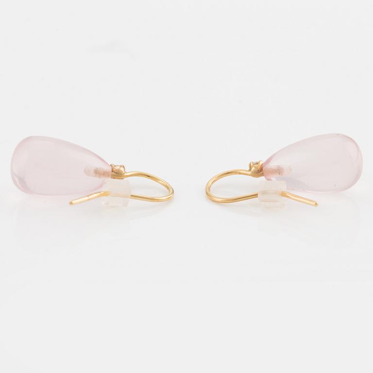 A pair of 18K gold earrings with rose quartz and round brilliant-cut diamonds.