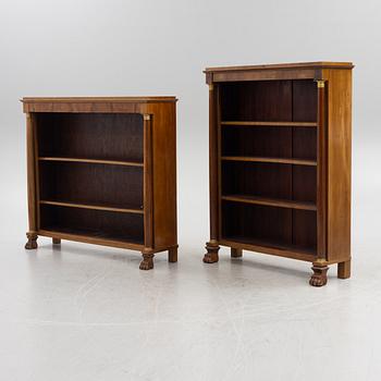 Two similar Empire style book cases, first half of the 20th century.