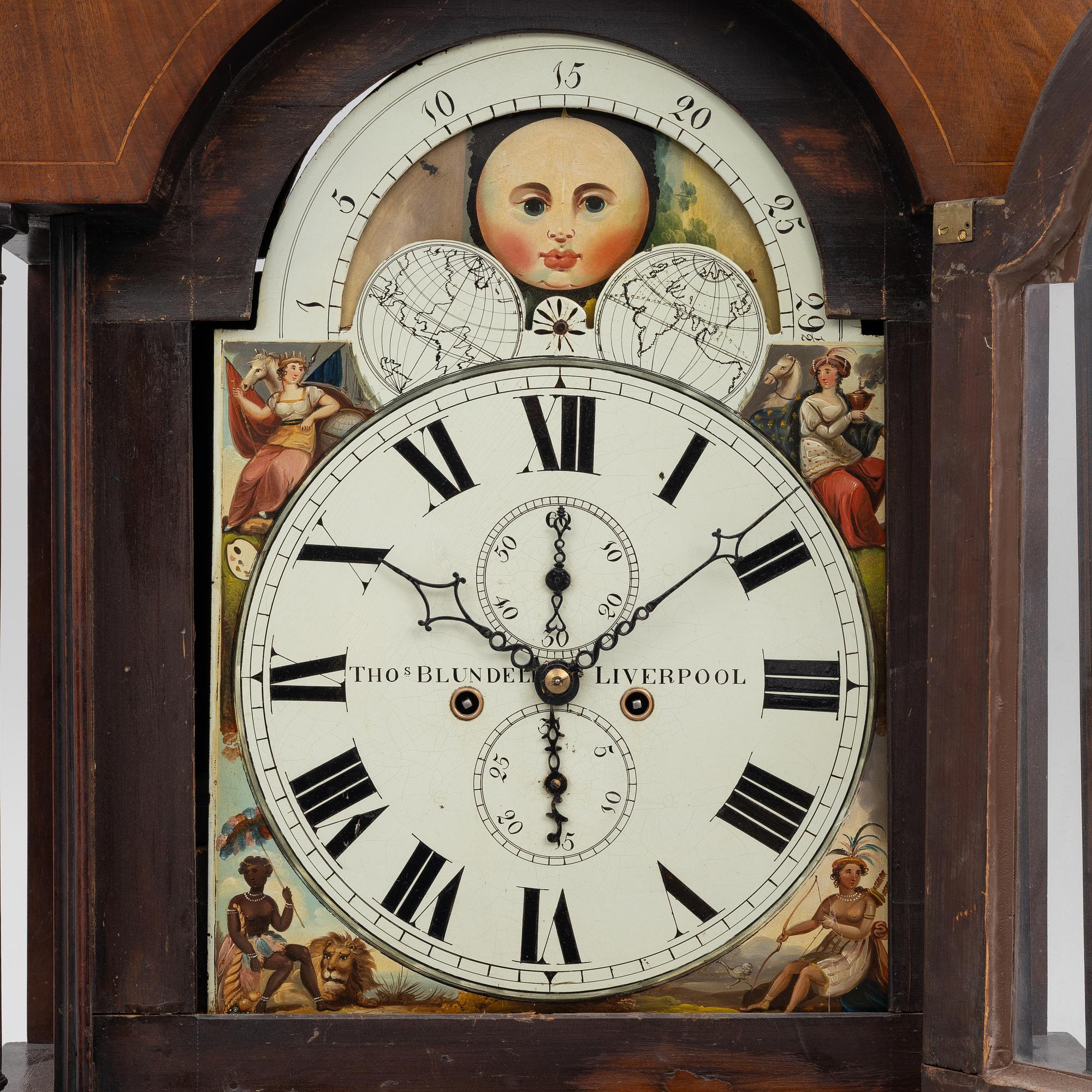 A long-case clock, England, 19th century.