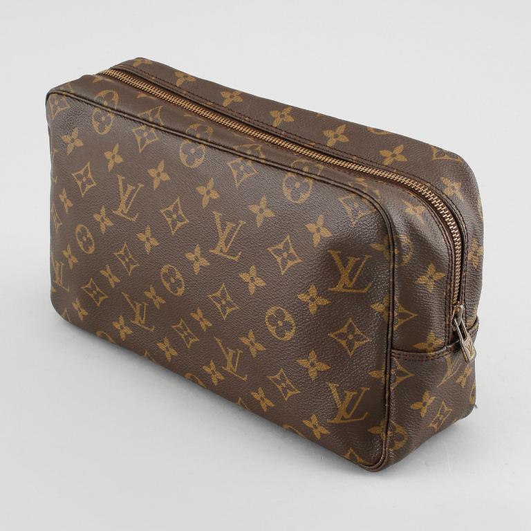 A Louis Vuitton "Trousse Toilette 28" beauty bag.