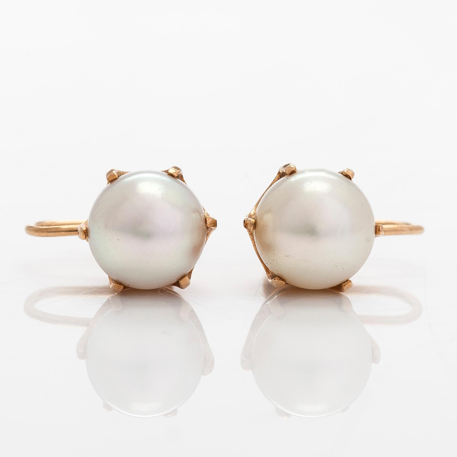 A pair of 14K gold earrings with cultured pearls.