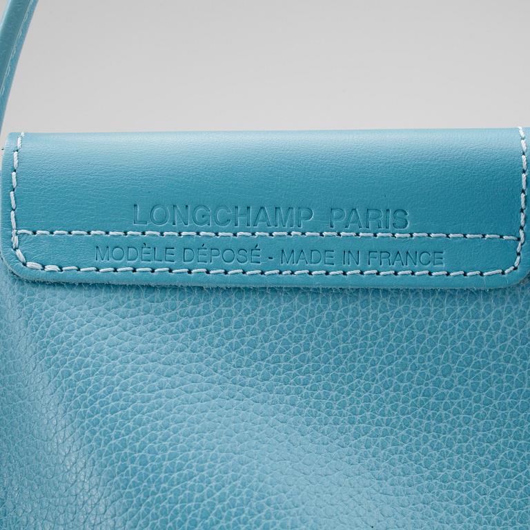 LONGCHAMP, a baby blue leather bag.