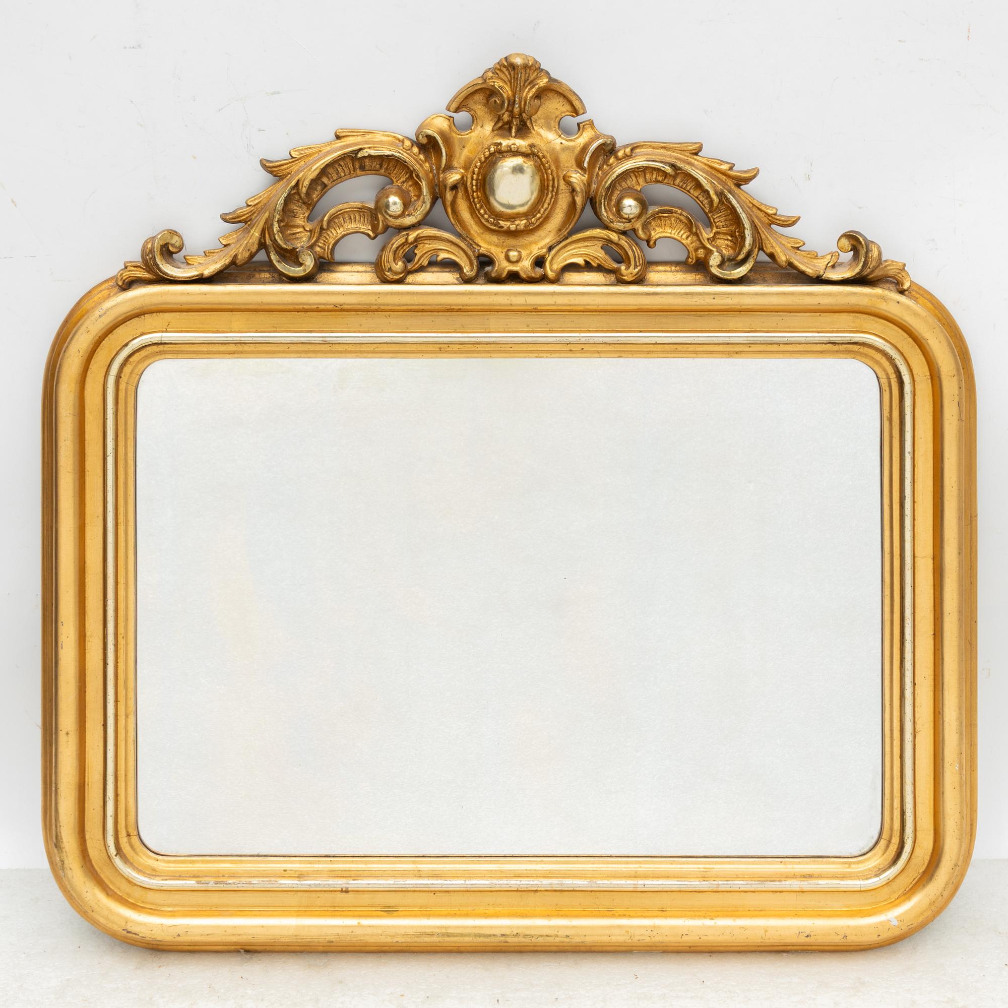 A rococo style mirror by AG Säfström Kristianstad from around the year 1900.