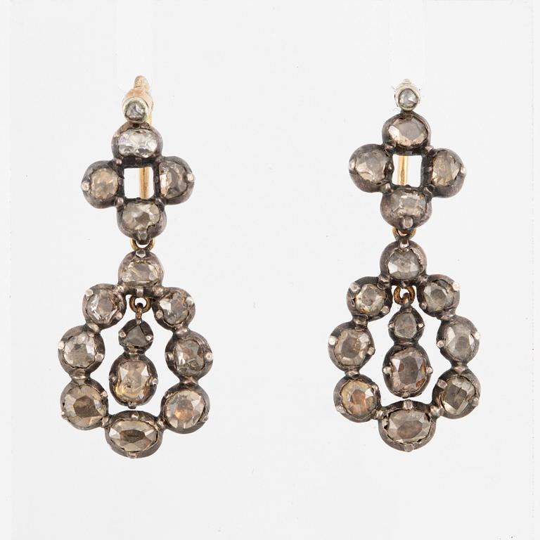 A pair of earrings in silver and 18K gold set with old-cut diamonds.