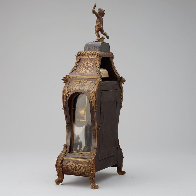 An 18th century mantel clock, probably Suisse.