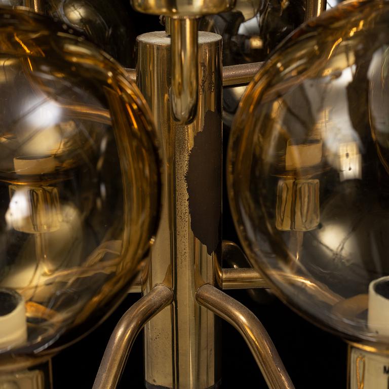 Hans-Agne Jakobsson, a late 20th century brass and glass ceiling lamp for nine lights, Markaryd, Sweden.