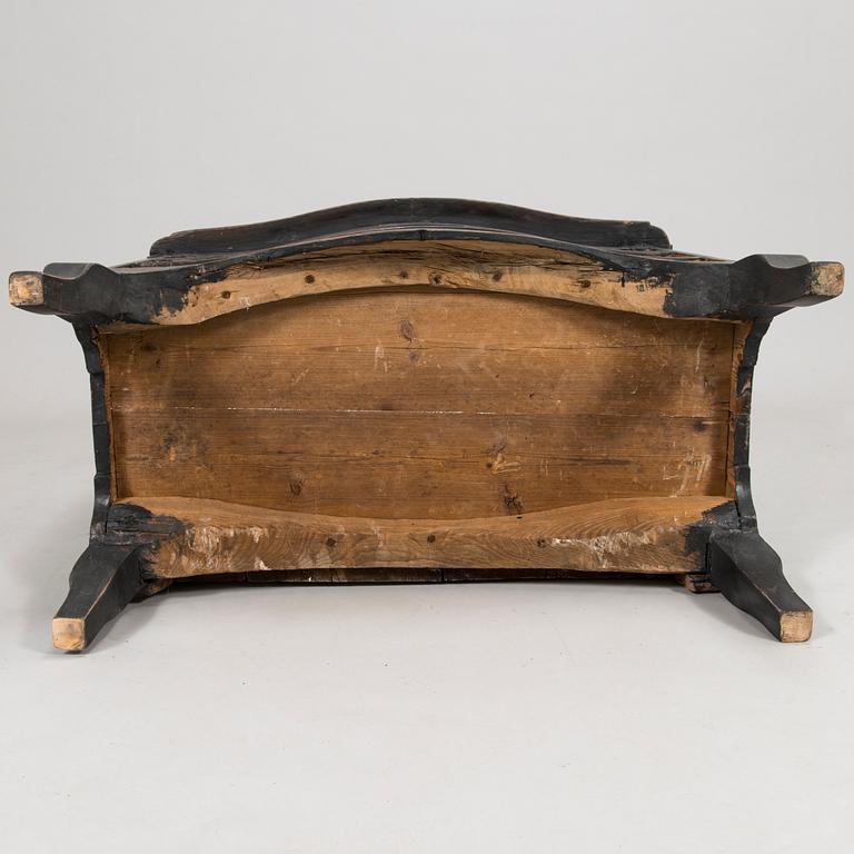 An 18th-Century chest of drawers.