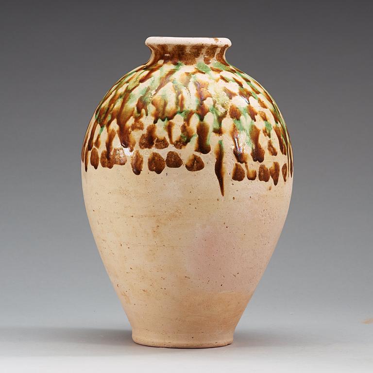 A Sancai-glazed pottery jar, Tang Dynasty (618-907).
