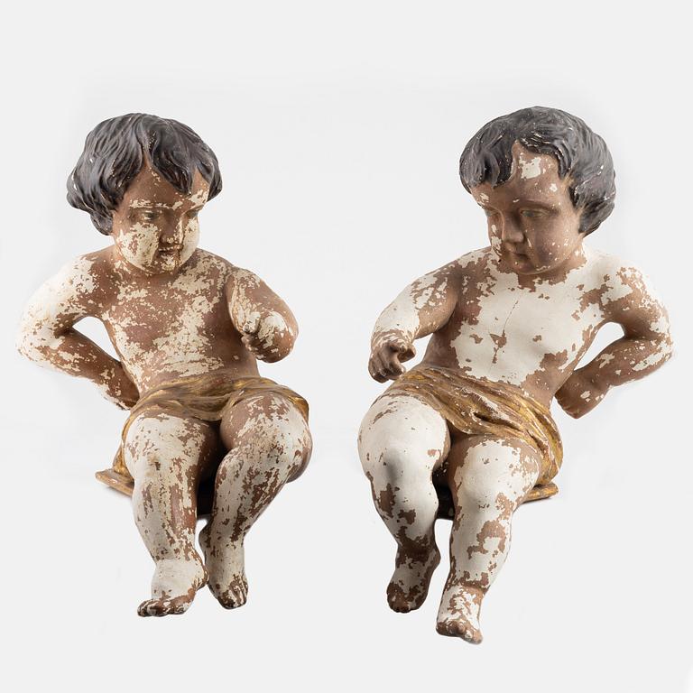 Wooden sculptures, a pair, putto, Europe, first half of the 19th century.