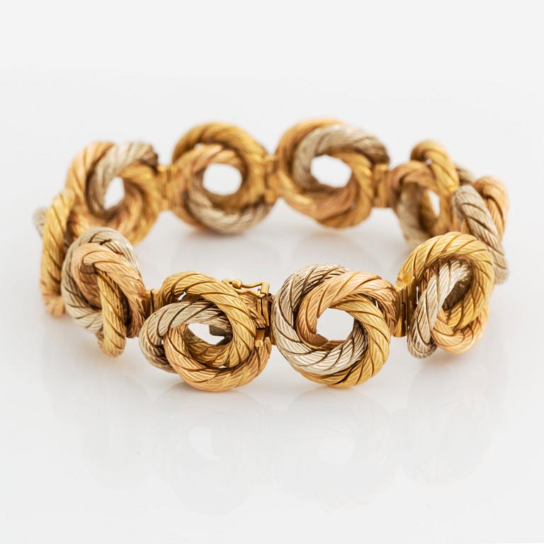 An 18K gold bracelet.