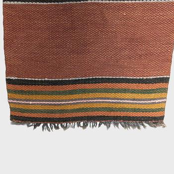 A 1930/1940s rag rug /runner. Circa 550 x 74 cm.