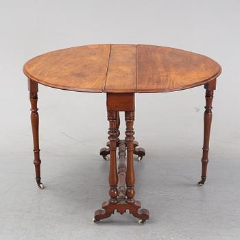 A neo-renaissance mahogany drop-leaf table from secord half of 19th century.