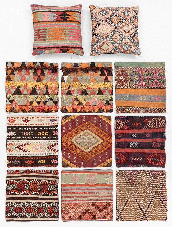Nine Kilim pillow cases and two Kilim pillows, around 1970, ca. 50 x 50 cm.
