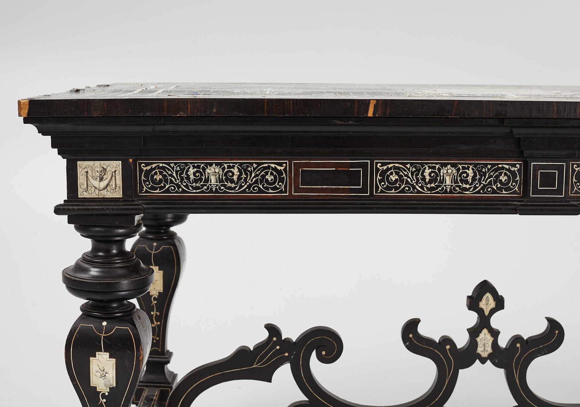 A Renaissance-style ebony, ebonized and ivory-inlaid library table, late 19th century, presumably Germany.