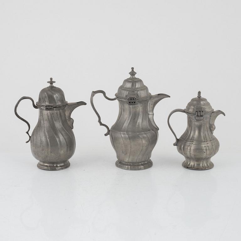 Three Rococo pewter coffee pots, 18th century.