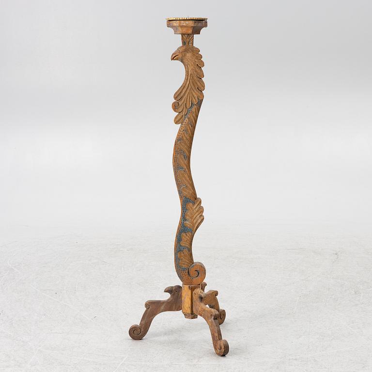 A carved wood floor candlestick, circa 1900 composed of 18th century elements.