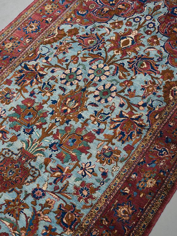 A RUG, a semi-antique silk Kashan, ca 201,5 x 122-130 cm.