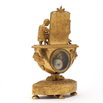 A French Empire early 19th century gilt bronze mantel clock.