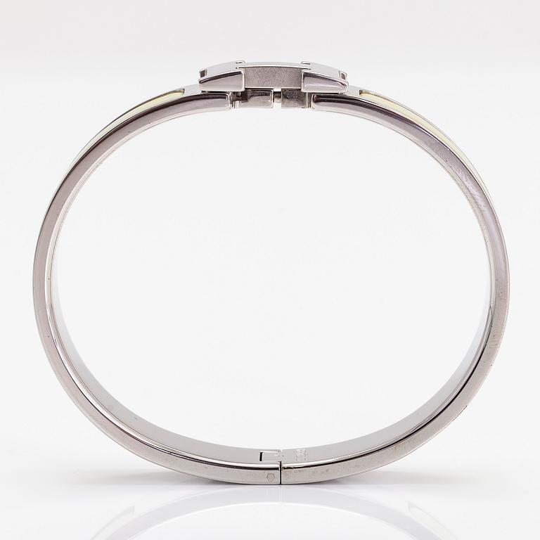 Hermès, a 'Clic H' PM bracelet.
