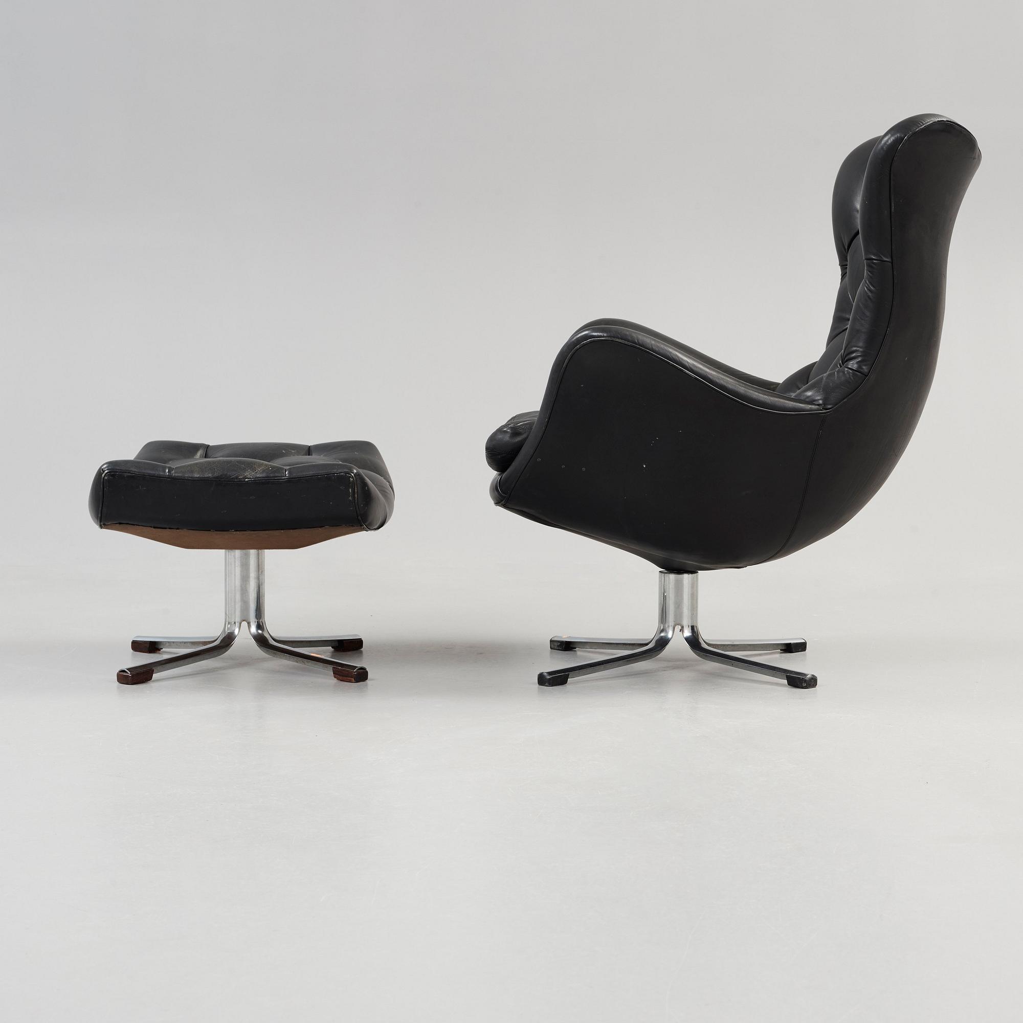 A Gustav Axel Berg 'Status' black leather easy chair with ottoman, Bröderna Andersson 1960's-70's.