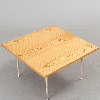 A coffee table marked Tapio Wirkkala, Asko, Made in Finland.