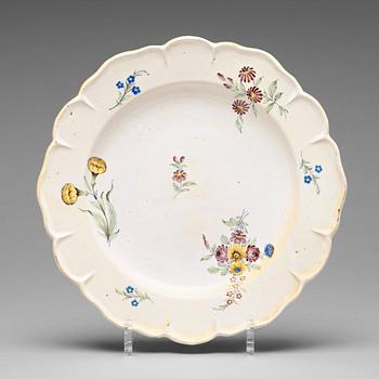 302. A set of six odd Swedish faience plates, Marieberg and Rörstrand, 18th Century.