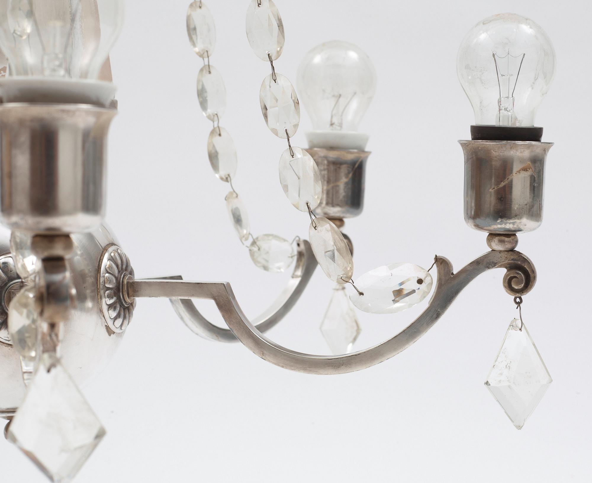 An Elis Bergh silver plated Swedish Grace chandelier, C.G. Hallberg, Stockholm.