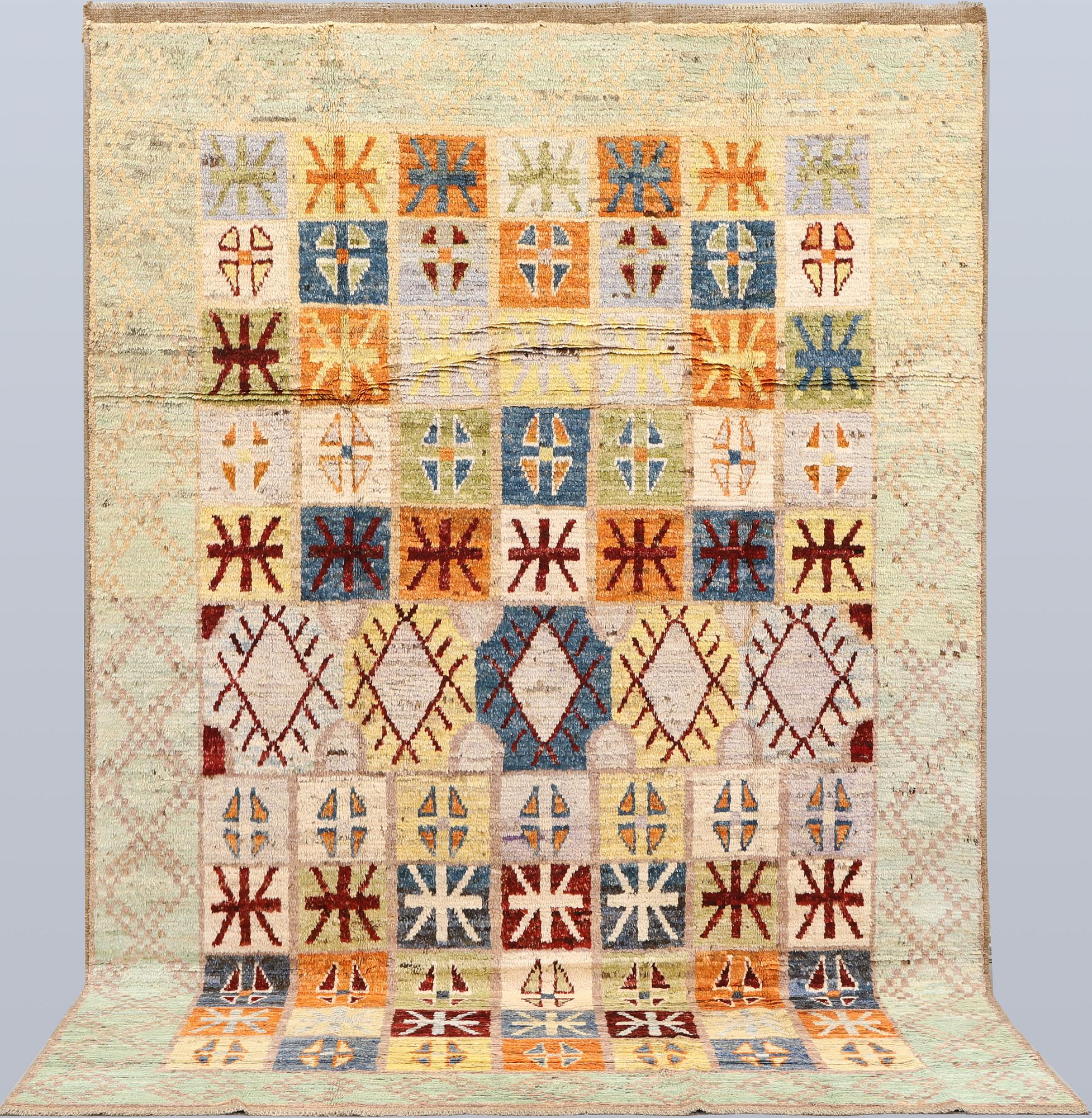 A Moroccan design carpet, c. 299 x 198 cm.