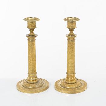 A pair of Empire candlesticks, France, early 19th Century.
