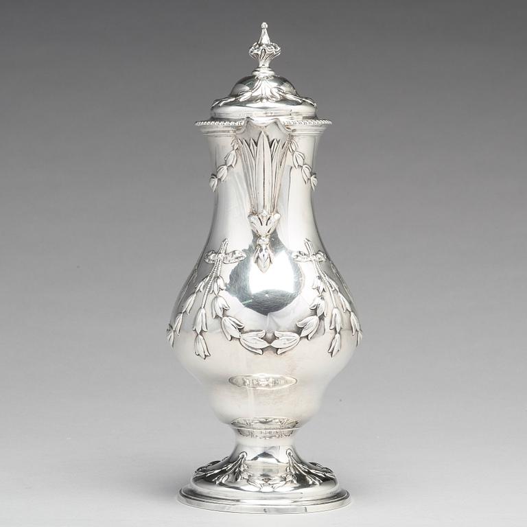 An English 18th century silver hot water-jug, mark of Chas Woodward, London 1773.