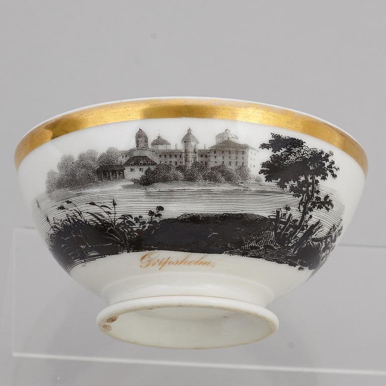 A group of seven cups, one with dish, Germany and France, 19th century.