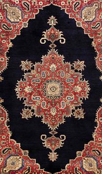 A carpet Tabriz around 265 x 170 cm.