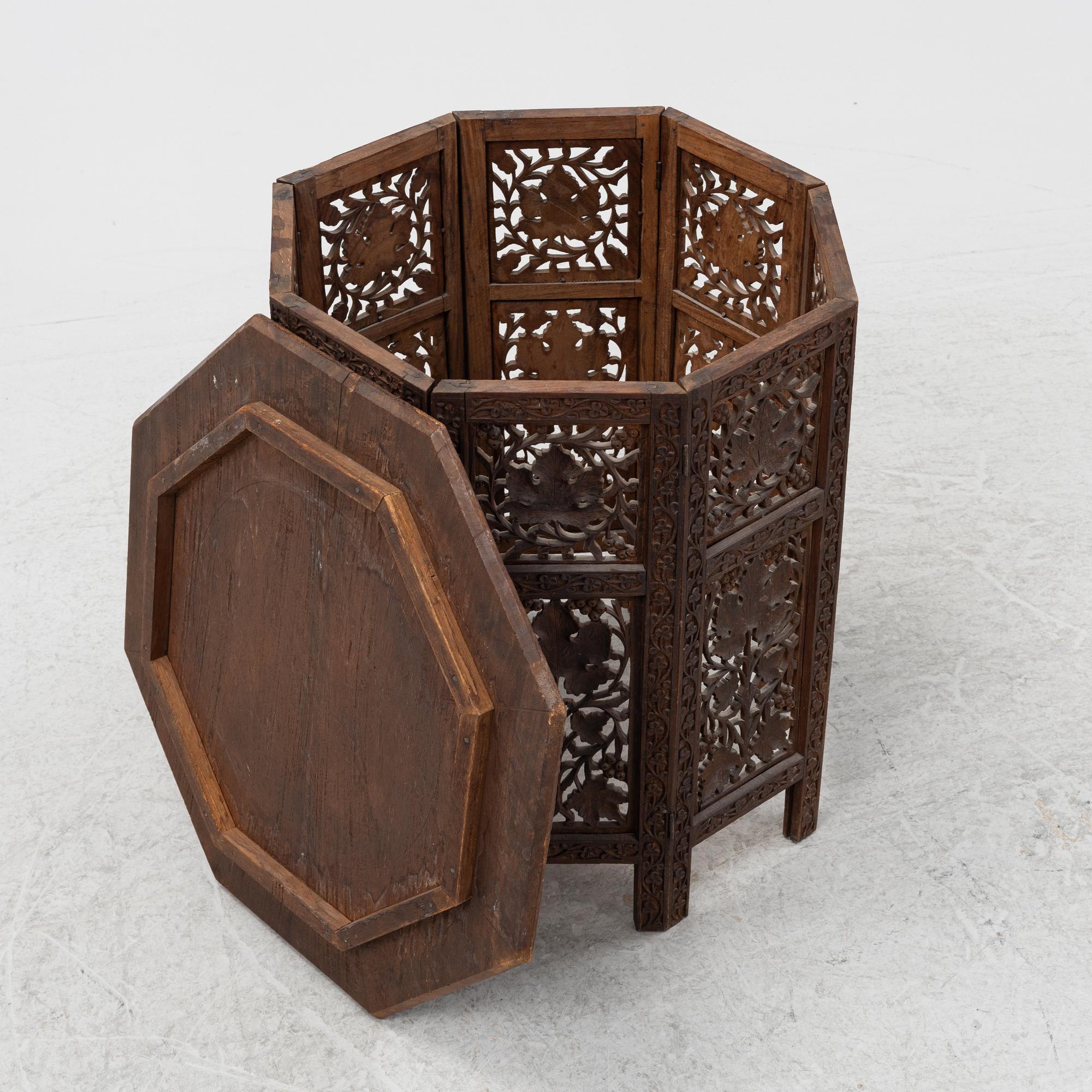 A carved table, first half of the 20th Century.