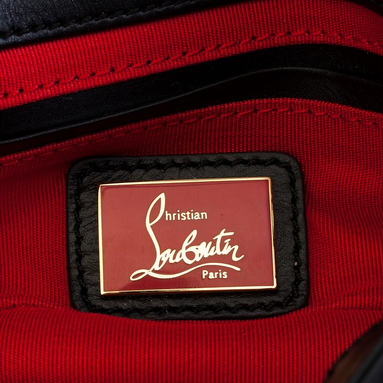 An eveningbag with studs by Christian Louboutin.