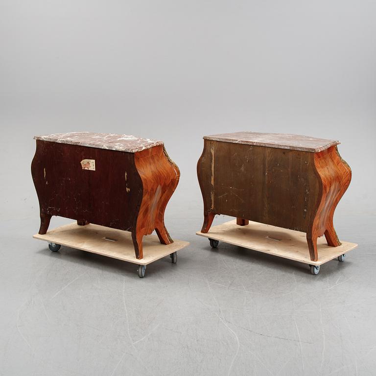 A pair of rococo style chest of drawers, mid 20th Century.