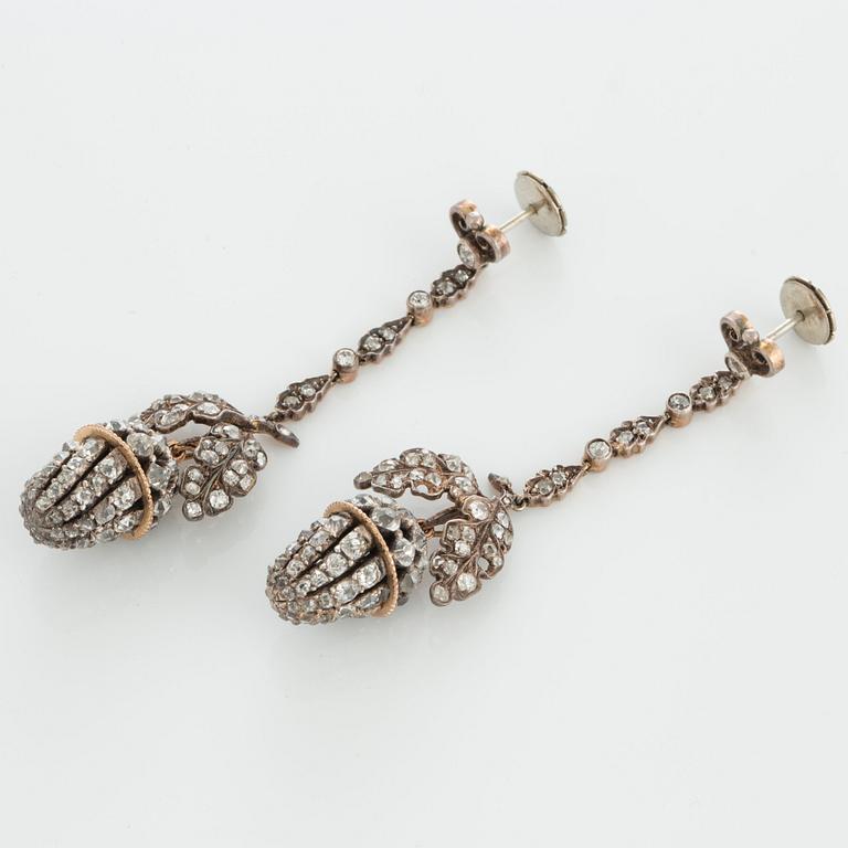 A pair of earrings set with old- and rose-cut diamonds.