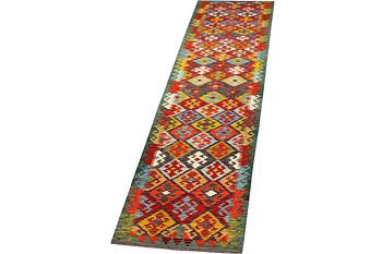 A runner carpet, Kilim, c. 507 x 85 cm.