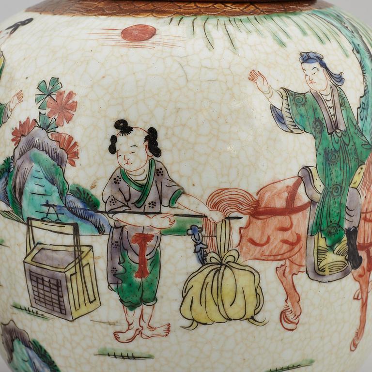 Two Chinese famille verte jars with wooden covers, first half of the 20th century.