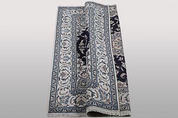 A carpet, Nain, part silk, ca 256 x 199 cm.