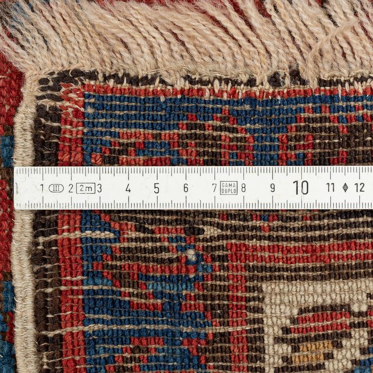 An antique carpet, probably Shirvan, c. 330 x 172 cm.