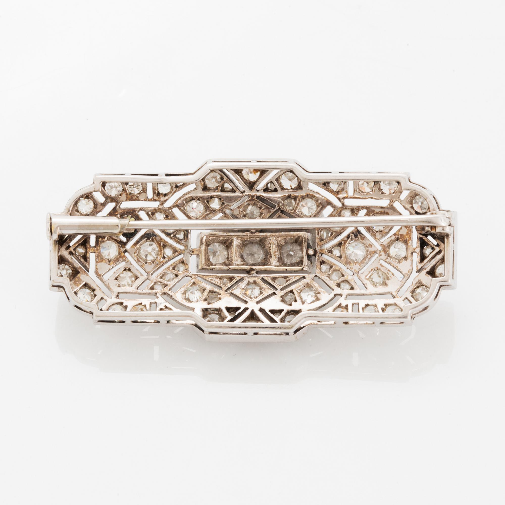 Rintaneula, 14 valkokultaa, vanhahiottuja ja ruusuhiottuja timantteja. n. 2.40 ct yht.