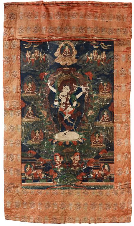 A Beijing Thangka of a four-armed goddess surrounded by Buddhist pantheon, 1920's.