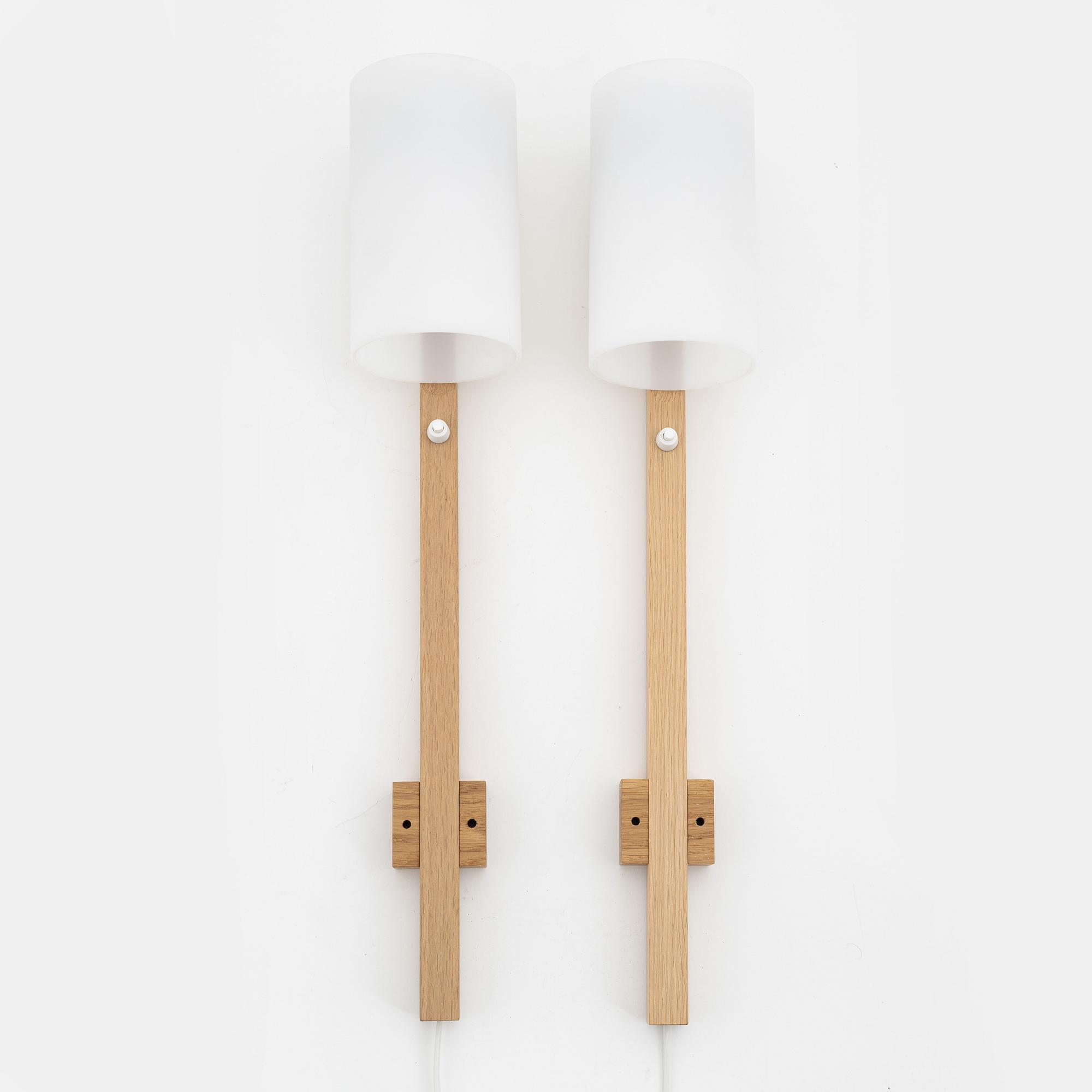 A pair of oak and acrylic wall lights, Luxus, Vittsjö.