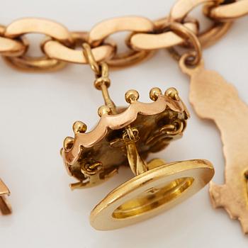 An 18K gold charm bracelet.