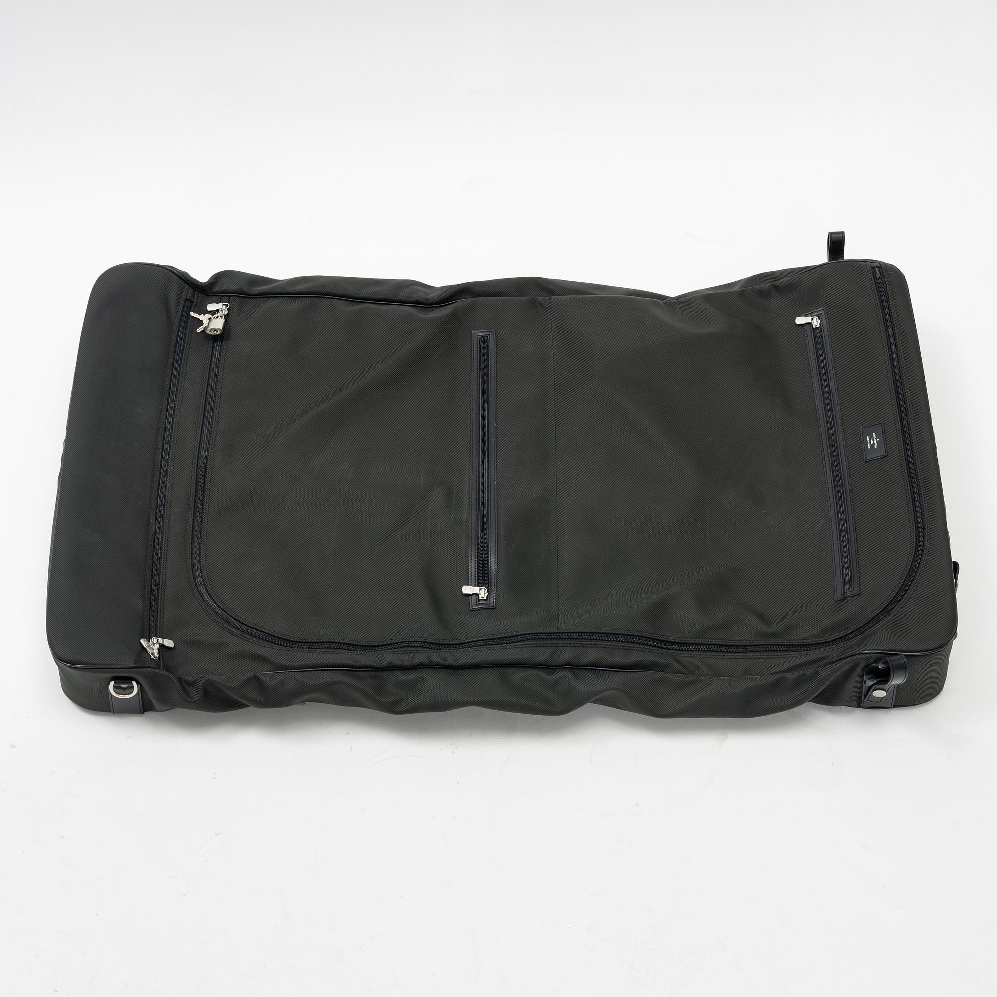 Louis Vuitton, a green canvas and Taiga garment bag.
