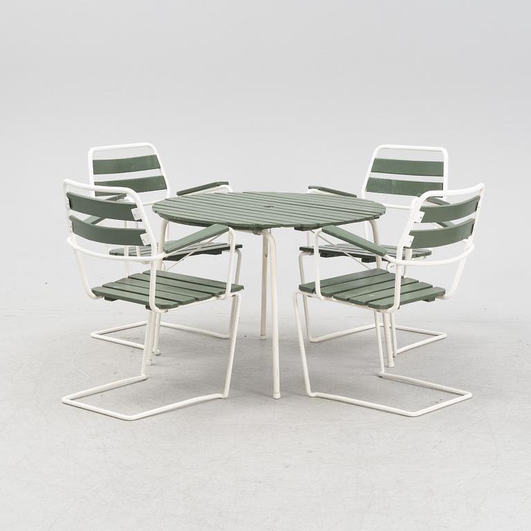 A mid  20th Century garden set with a table and four chairs.