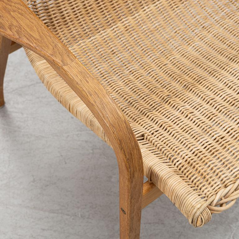 Yngve Ekström, armchair and footstool, "Lamino", Swedese.