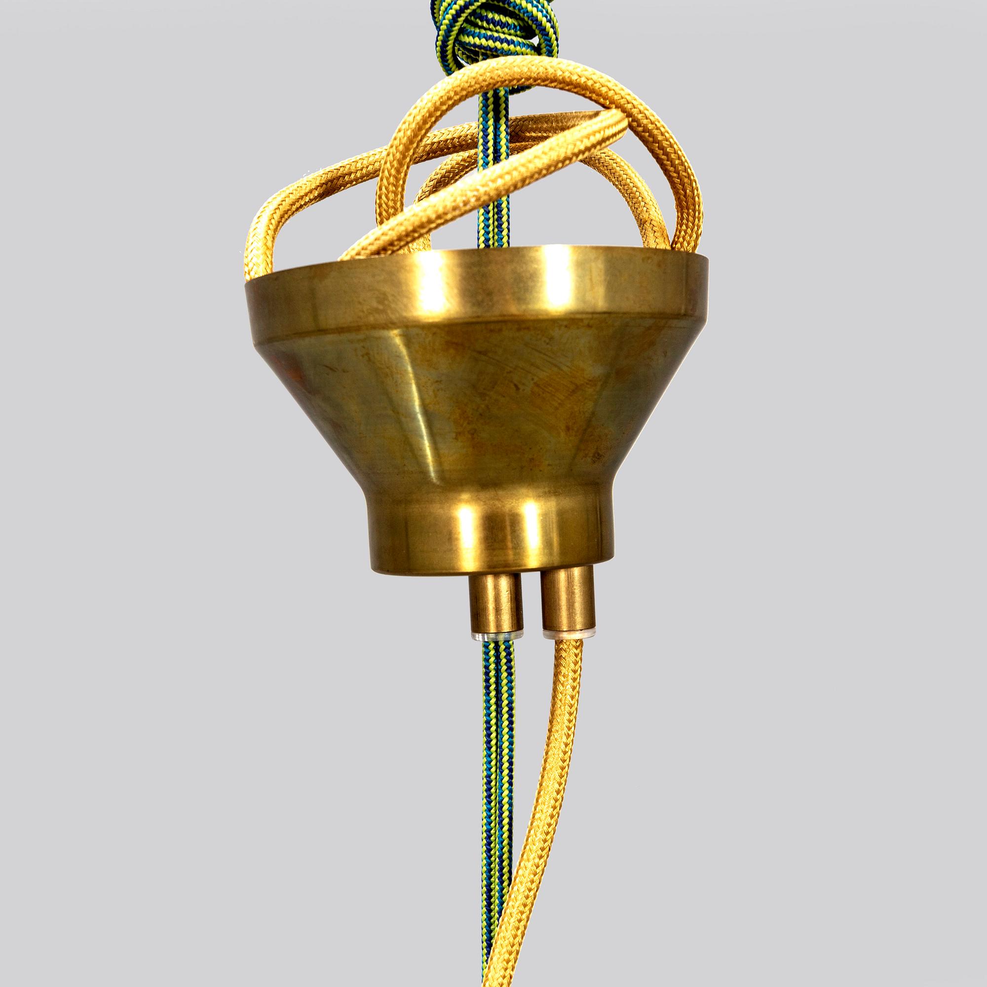 A contemporary 'Hobo' brass and glass pendant lamp by Gustaf Nordenskiöld for Örsjö.